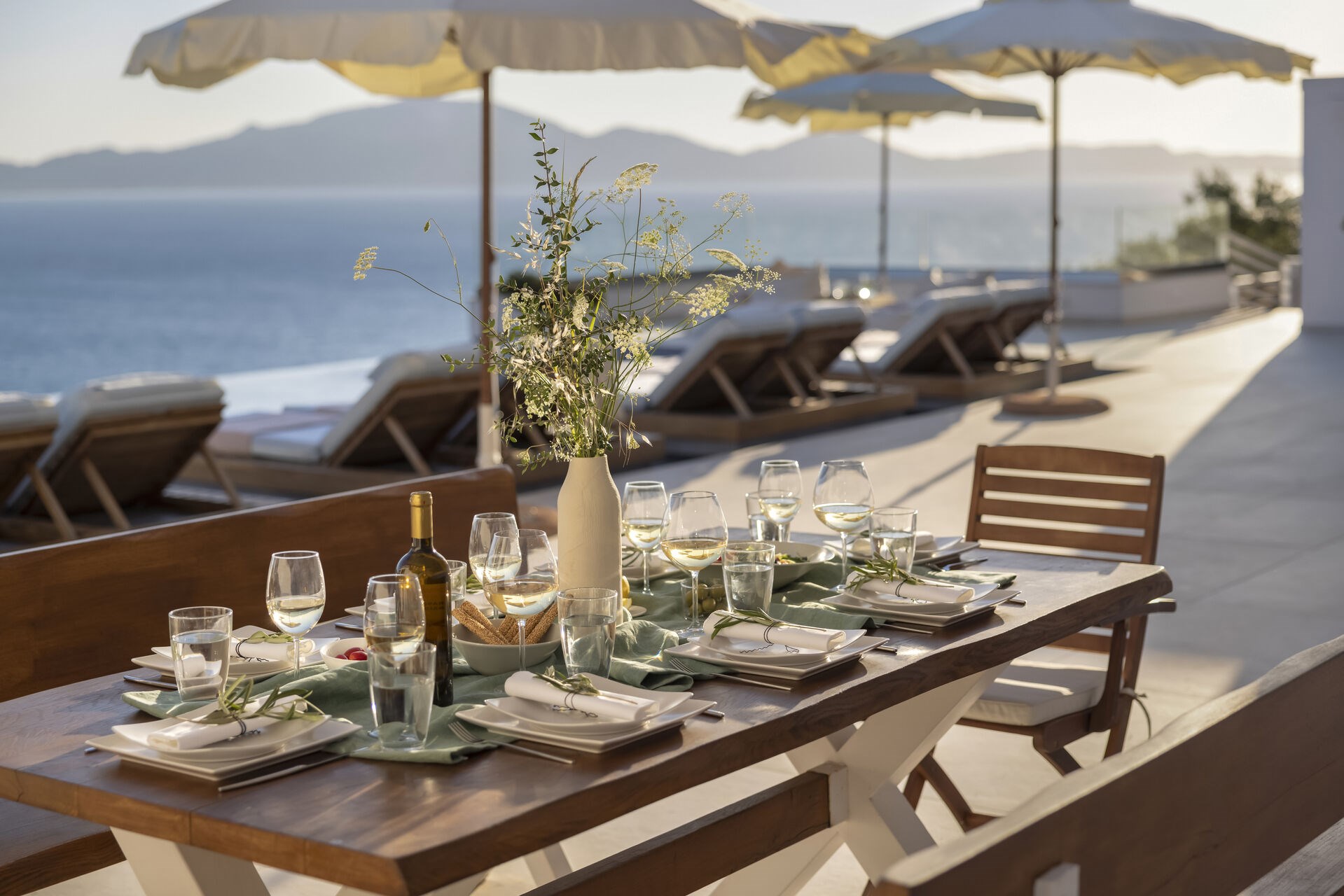 A covered outdoor dining space, ideal for evenings spent together by the pool.