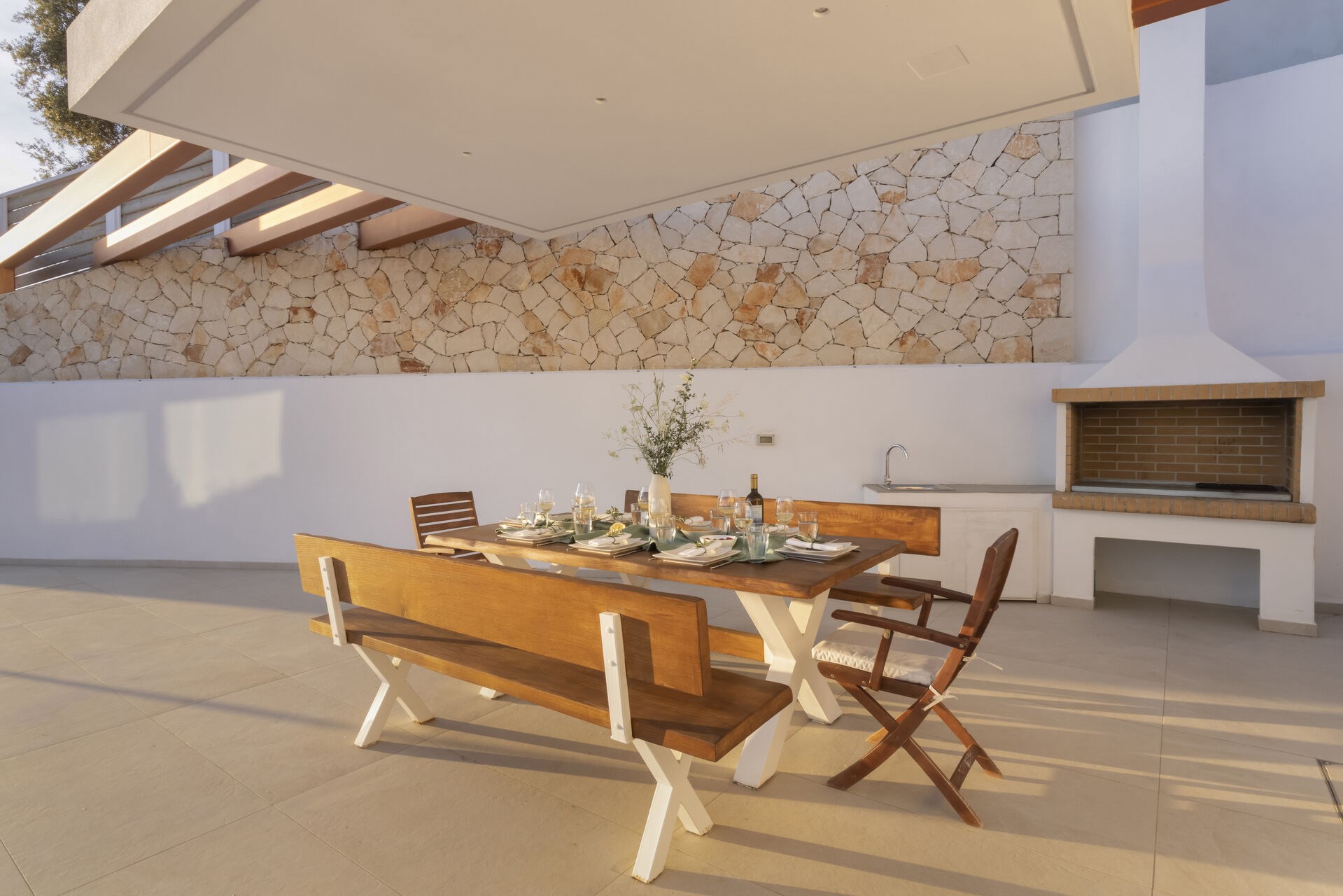 A covered outdoor dining space, ideal for evenings spent together by the pool.