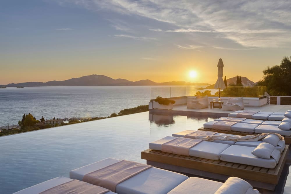 The villa's infinity pool, its edge blending seamlessly into the view of Keri Bay.