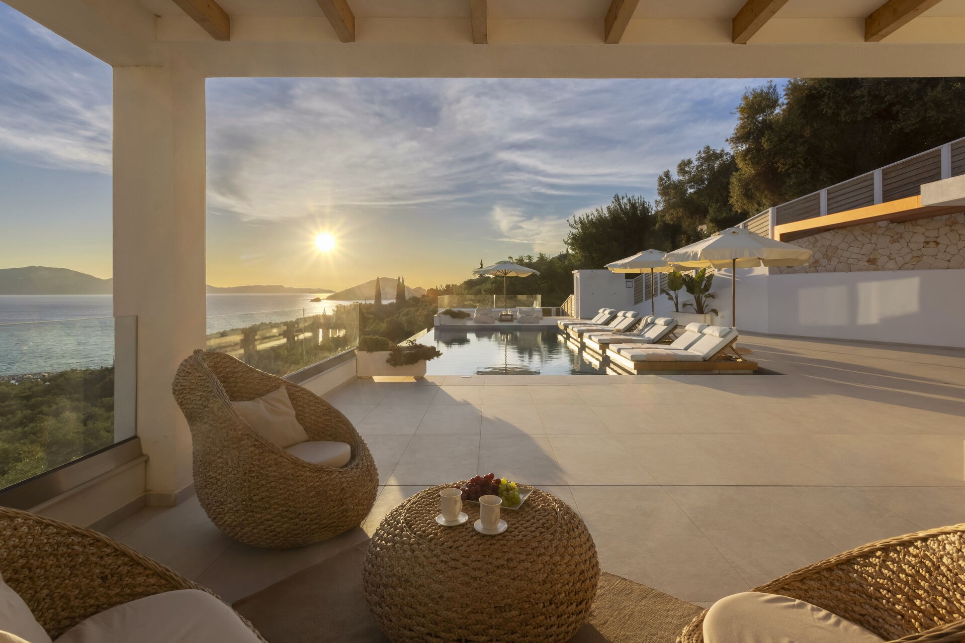 The villa's infinity pool, its edge blending seamlessly into the view of Keri Bay.